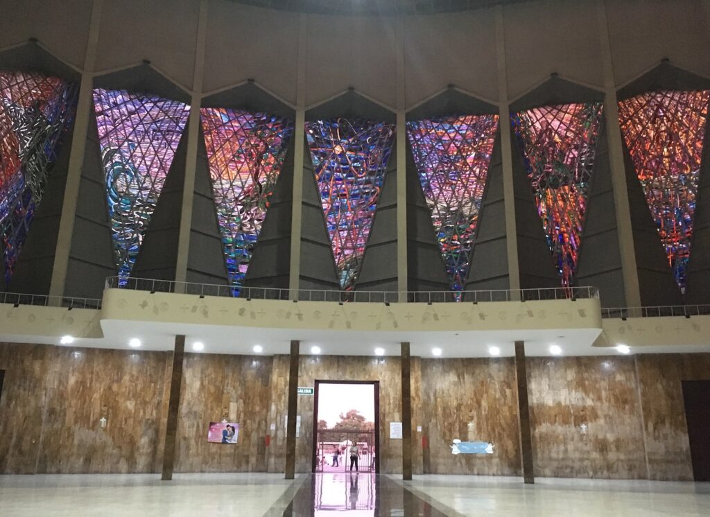 Enormous multicolored stained glass windows inside the Catedral Metropolitano in Barranquilla, Colombia, photo ©Kate Dana