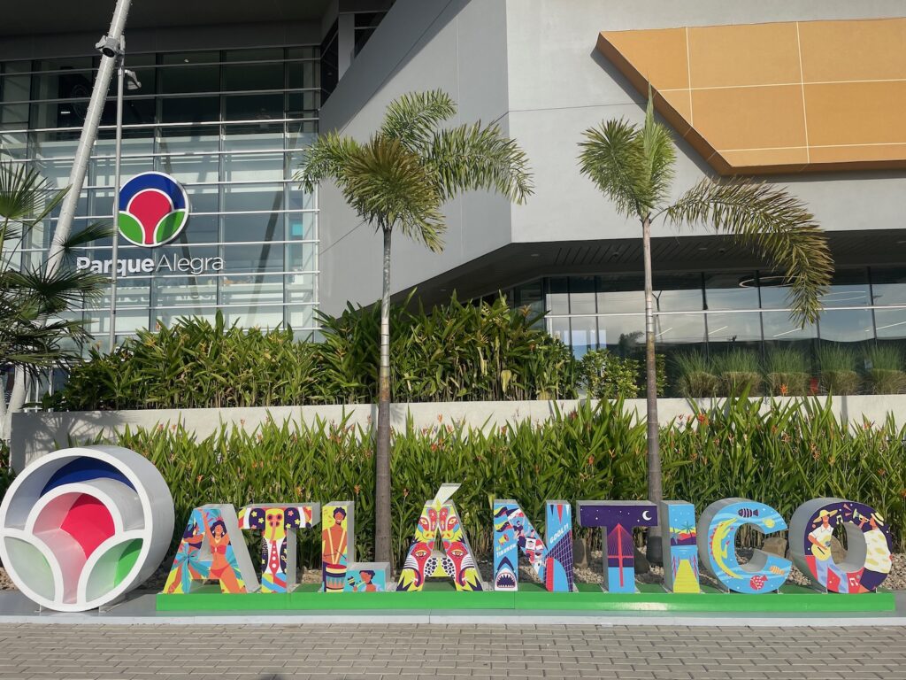 A colorful lettered sign outside of CC Parque Alegra announces Atlántico, the department of Barranquilla, Colombia, photo ©Kate Dana