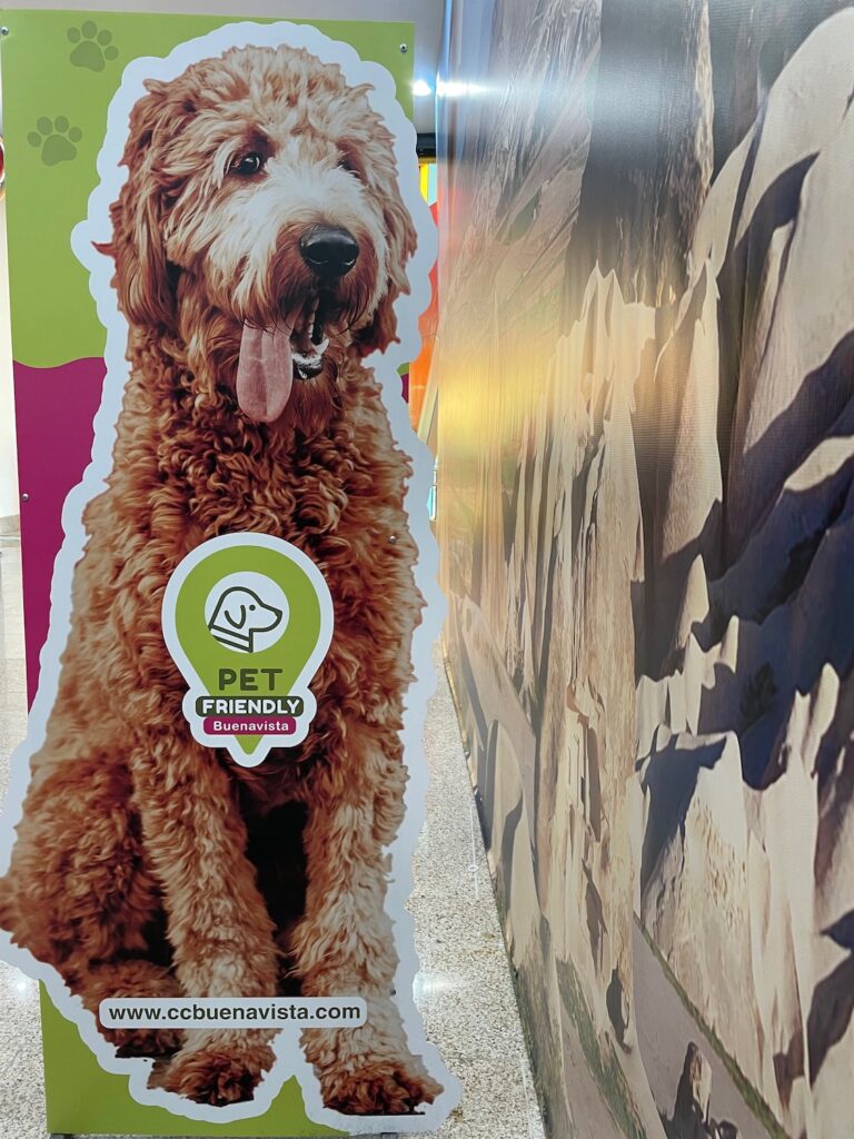 A cutout image of a friendly dog annonces the mall is pet-friendly at CC Buenavista in Barranquilla, Colombia, photo ©Kate Dana
