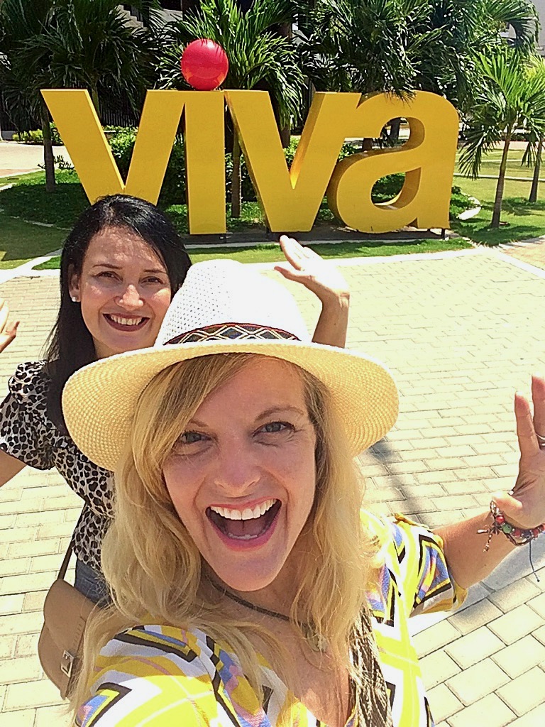 Travel blogger Kate Dana and a friend smiling outside of CC Viva in Barranquilla, Colombia, photo ©Kate Dana