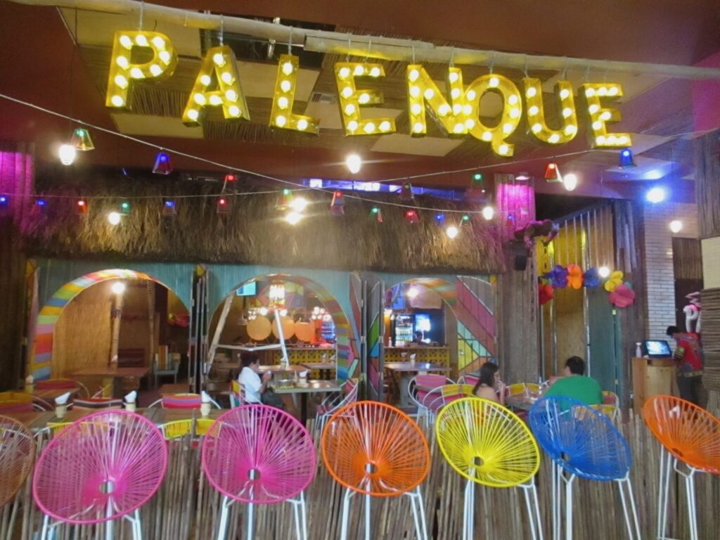 Palenque restaurant sign of colorful, lighted letters welcome guests at CC Viva in Barranquilla, Colombia, photo ©Kate Dana